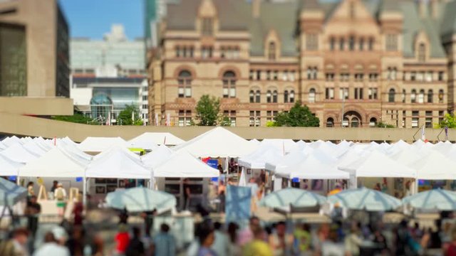 Tilt–shift Queen and Bay, Fountain at Nathan Phillips Square time lapse of people walking , view of Toronto landmark and Canada tourist attraction. 4k.