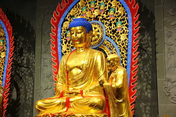 Fototapeta na wymiar golden bodhisattva GUANYIN carving in Thailand