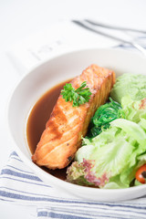 Salmon fish steak grilled and fresh vegetable salad