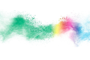 Freeze motion of colorful color powder exploding on white background.  Paint Holi.