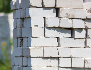 White bricks lay on a house construction site