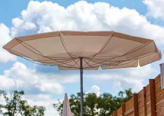 Umbrella blows by the wind on the beach