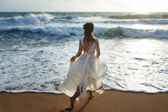 Beautiful Bride Running On The Beach