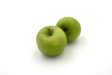 Fresh green apples isolated on white background. Top view.