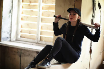 A young person with a baseball bat