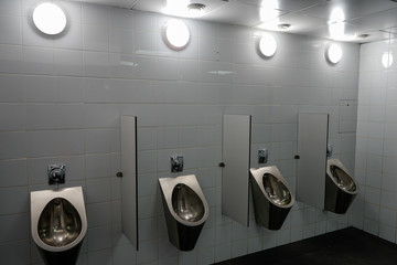 toilet room with urinals