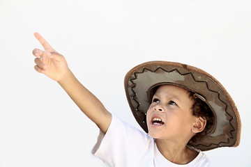 boy reaching for to the sky with hat on head stock image stock photo