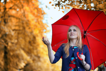 Girl in the street with an umbrella