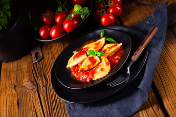 ravioli alla genovese with basil tomato sauce