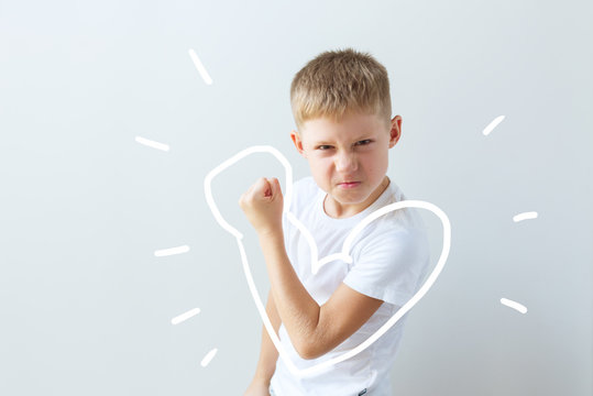 Child shows his force in the bent hand. Muscles