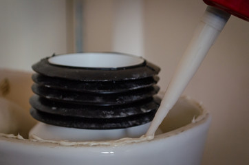 Gluing toilet bowl