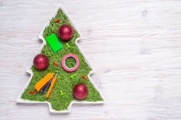 Christmas tree concept, spruce needles in porcelain plate, Office  Christmas decorations