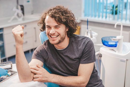 Portrait of a handsome young Hispanic man right after taking a blood test in a laboratory - Powered by Adobe