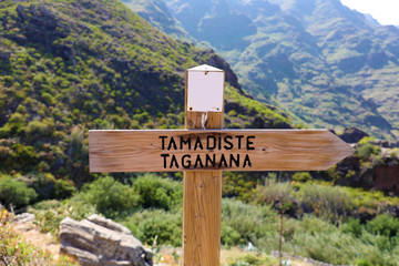 Directional sign to coastal village of Taganana and Tamadiste beach, Tenerife, Canary Islands, Spain. Natural trekking tourism concept.