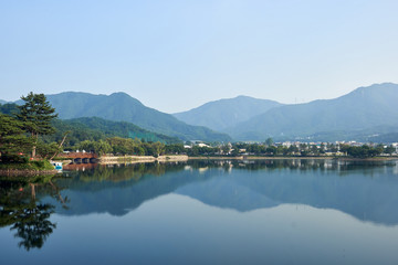 A view of Uirimji Reservoir and the reflection of its surroundings in Jechun, South Korea.