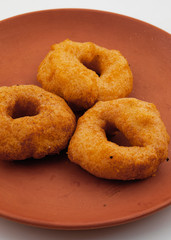 South Indian Popular Breakfast Vada Served With Sambar And Coconut Chutney Also Know as Vadai, Vade or Medu Vada
