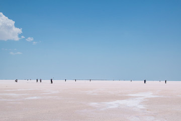 Turkey: people in the distance walking on the salt expanse of Lake Tuz, Tuz Golu, the Salt Lake, the second largest lake in Turkey and one of the largest hypersaline lakes in the world