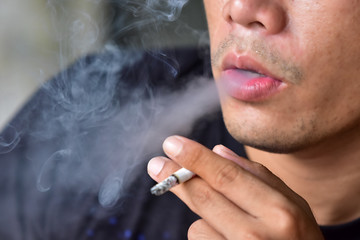 man smoking a cigarette