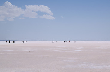 Turkey: people in the distance walking on the salt expanse of Lake Tuz, Tuz Golu, the Salt Lake, the second largest lake in Turkey and one of the largest hypersaline lakes in the world