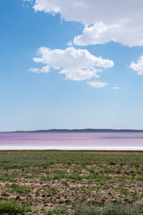 Fototapeta na wymiar Turkey, Central Anatolia Region: aerial view of the Lake Tuz, Tuz Golu, pink and red water of the Salt Lake, the second largest lake in Turkey and one of the largest hypersaline lakes in the world