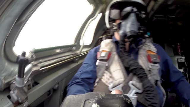 The pilot checks the control knob