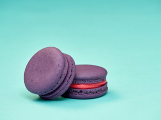 Colorful macarons on a blue background