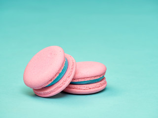 Colorful macarons on a blue background