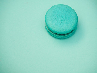 Colorful macarons on a blue background