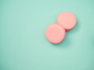 Colorful macarons on a blue background