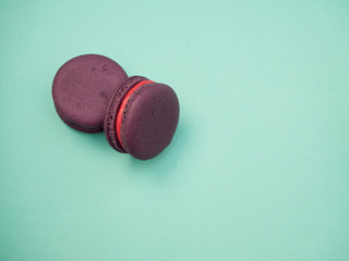 Colorful macarons on a blue background