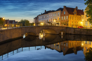 Noctilucent clouds (night shining clouds) at city Bruges (Brugge) old town in Belgium in the dusk,...
