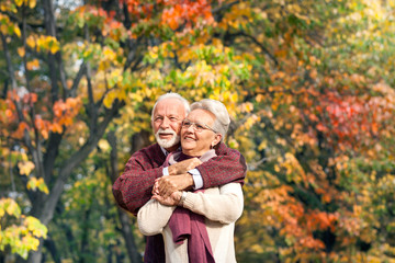 Portrait of a senior couple in autumn park
