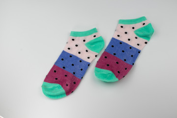 A pair of cotton women's socks on the table.