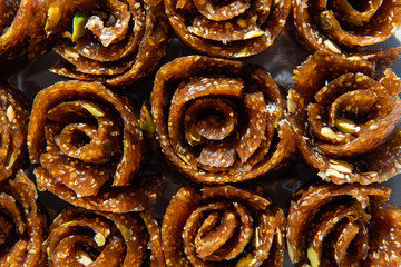 Close up of Turkish delights with figs mixed with chunks of pistachio. Rolled sweet snack. Izmir, Turkey.