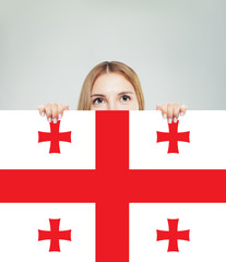 Happy girl student with the Georgia flag background