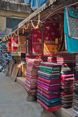 Pashmina, woolen plaids, silk scarfs and weightless pareo on asian market