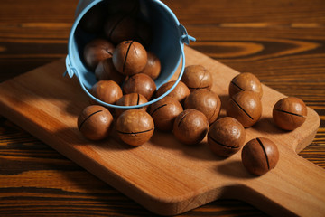 macadamia nuts lie on a black background