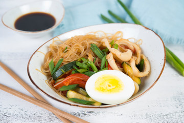 Traditional Asian stir fry with noodles, seafood and vegetables.