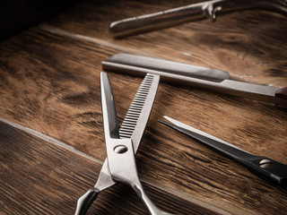 the barber shops tools on wooden desk.