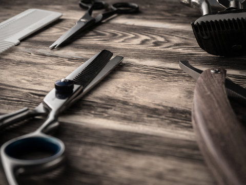 barber shops tools on wooden desk. pasteurized image