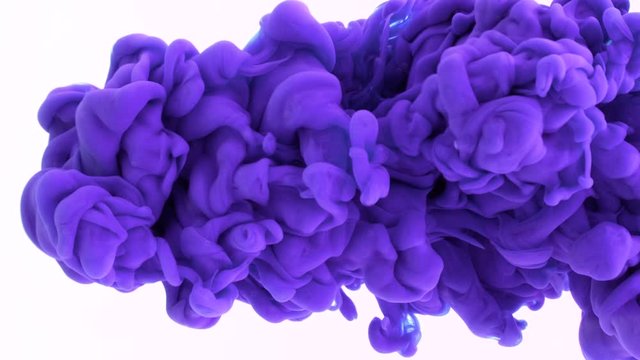 Violet ink reacting in water creating abstract background.