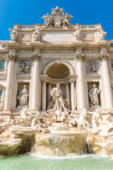 Fototapeta na wymiar Trevi fountain (Fontana di Trevi) at sunny day, Rome, Italy. Baroque architecture. Trevi fountain is one of the main attractions of Rome city.