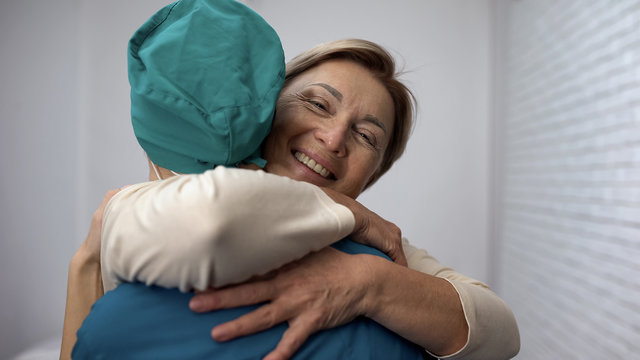 Happy Woman Hugging Doctor, Good Test Results, Recovery And Remission, Gratitude