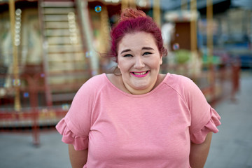 Young woman standing in city amusement park