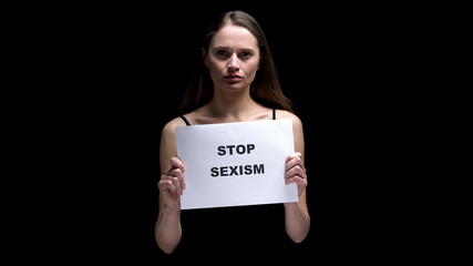 Woman showing stop sexism sign, campaign against prejudice or discrimination