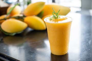 Glass of Mango juice on Marble Stone table. © sbo.ow-j