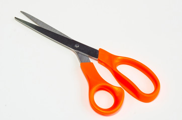 Orange scissors on a white background Background image