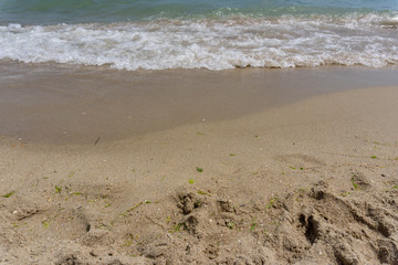 Beach close-up: sand and waves