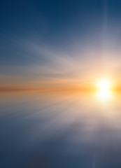 Fototapeta na wymiar Abstract Beautiful calm sea at sunset with sun and cirrus clouds.