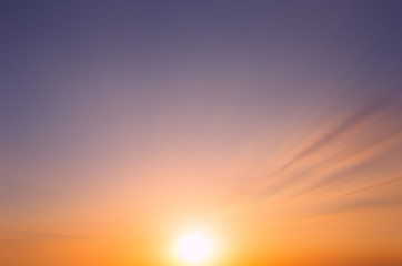 Abstract Early sunny morning and the dawn sun with rays on a few clouds.